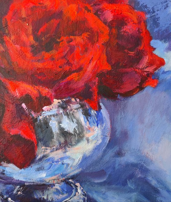 Red roses in a metal vase
