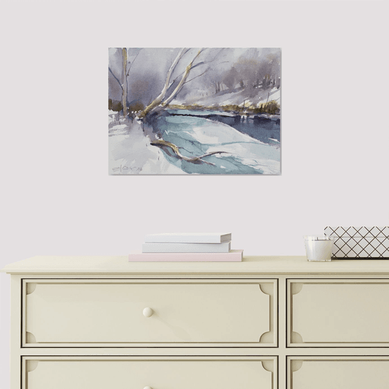 Snowscape with frozen river