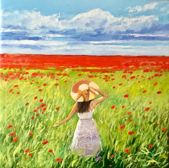 Women in poppy field