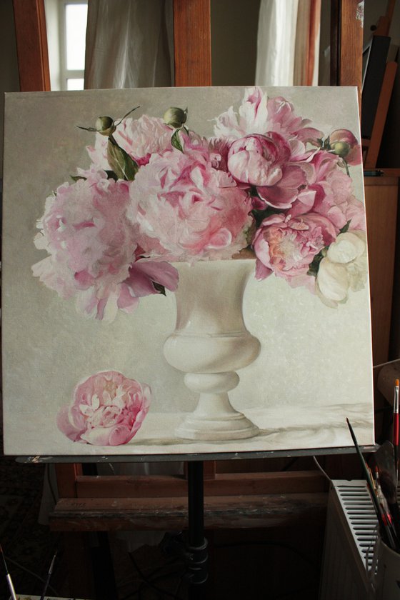 Bouquet of peonies in a white vase