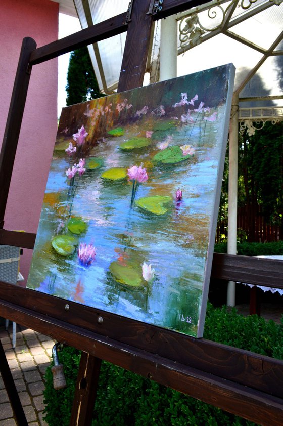 Pond with pink lilies