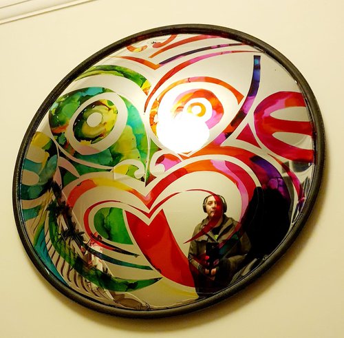 Convex Tiki mirror by Frederick Worrell