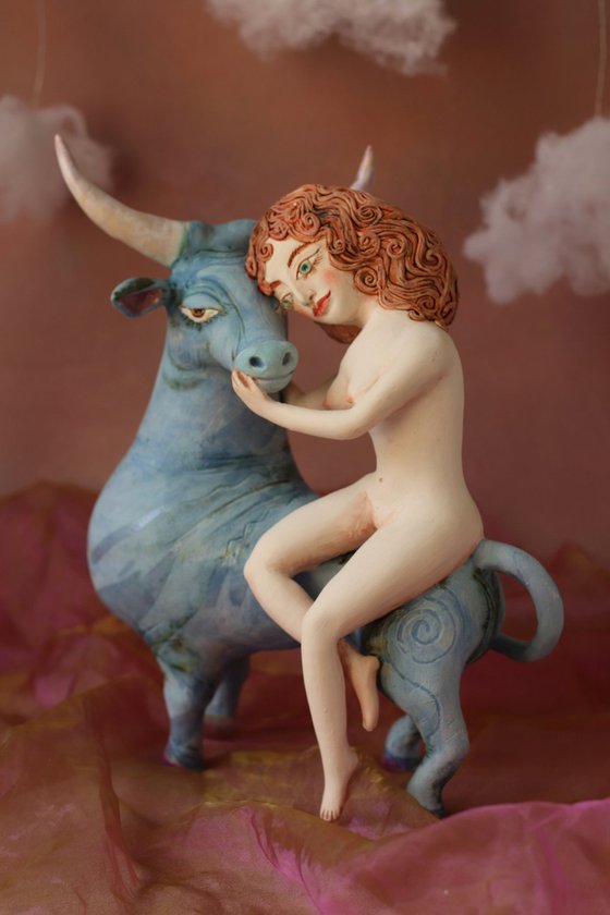 Riding your dreams. Girl on a blue ox