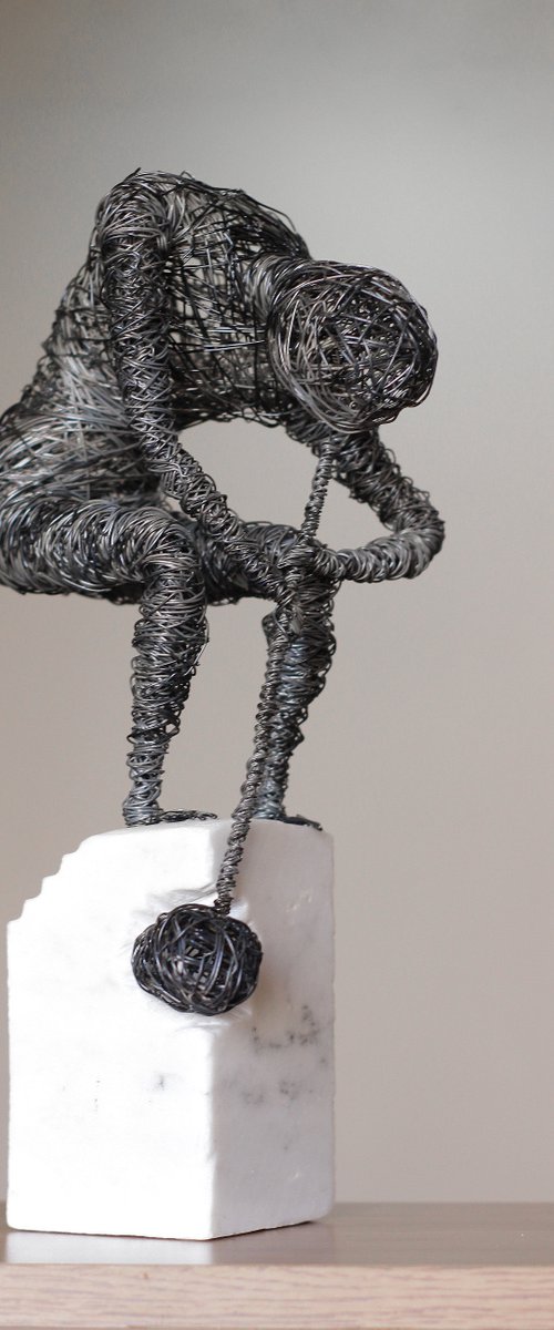 Self-violence (35x18x12 2.7kg iron, marble) by Karen Axikyan