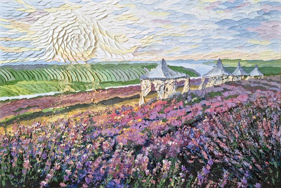 Lavender at sunset. Relief landscape with a purple field. Summer blooming