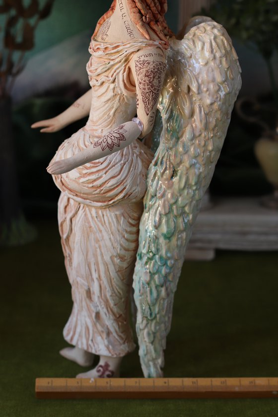 Angel with a tattoo. Ceramic OOAK sculpture.