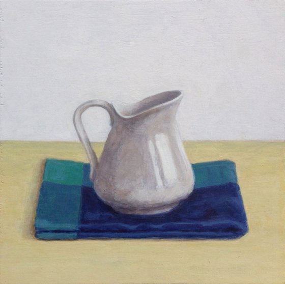 Milk jug and tea towel