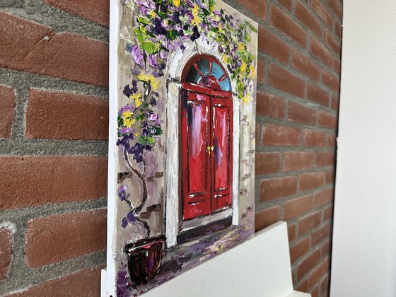 Red door with flowers