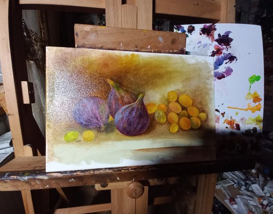 Still life with figs and a bunch of grapes