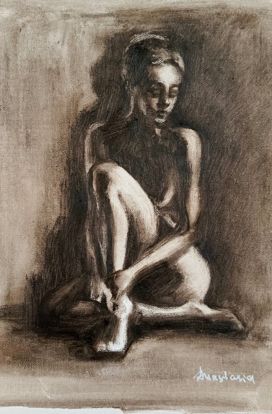 Nude woman sitting