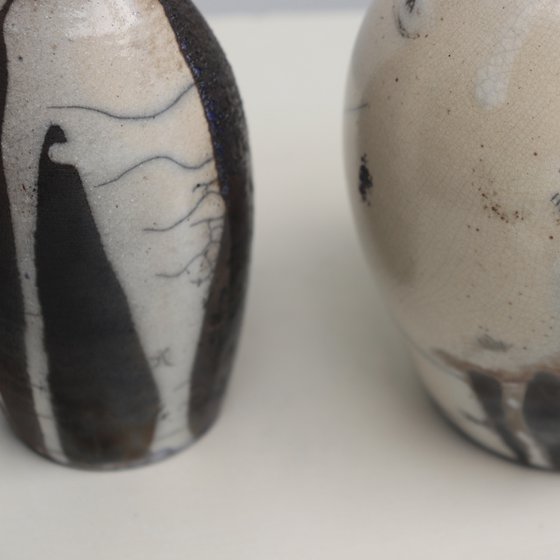 2 raku and black vessels