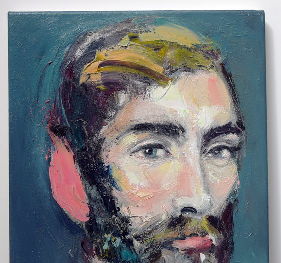 Portrait of a bearded man with a burning ear