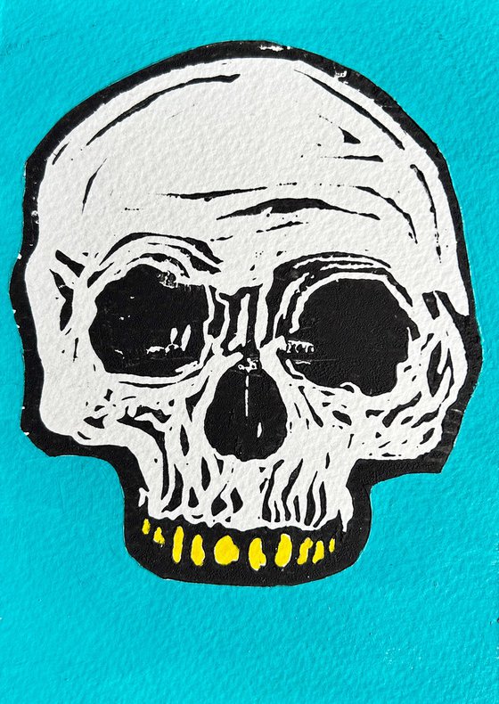 Teeny tiny skull lino print