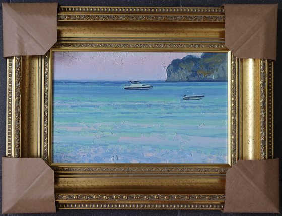 Sunset. Boats on the sea