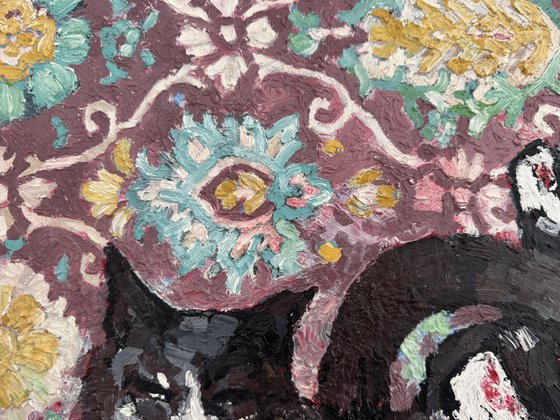 Black cat at the carpet