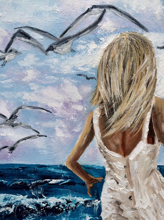 Girl chasing a seagulls