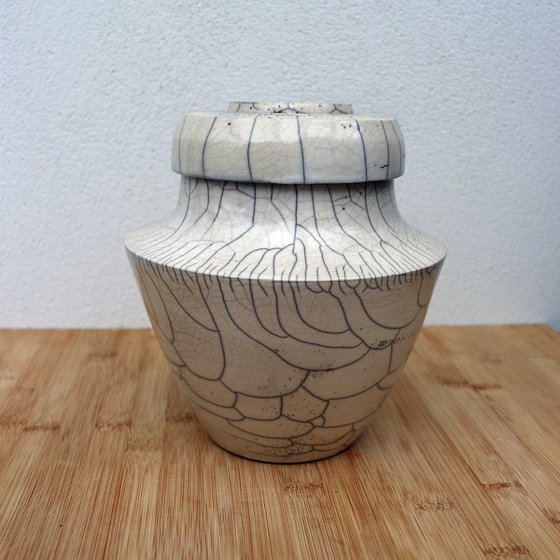 Raku vessel with lit