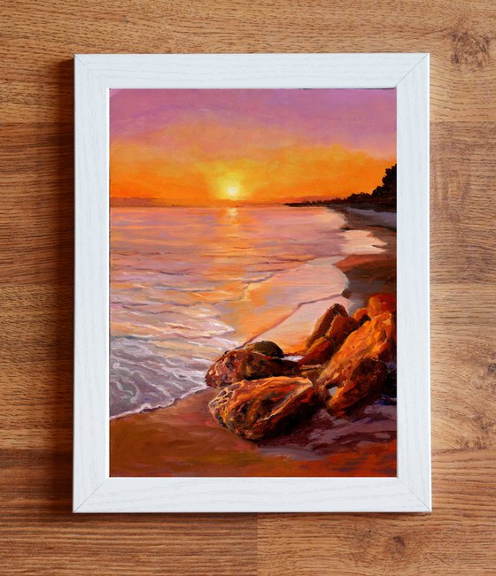 Sunset beach seascape with rocks