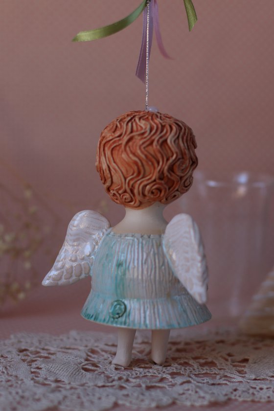 Tiny hanging sculpture. Angel