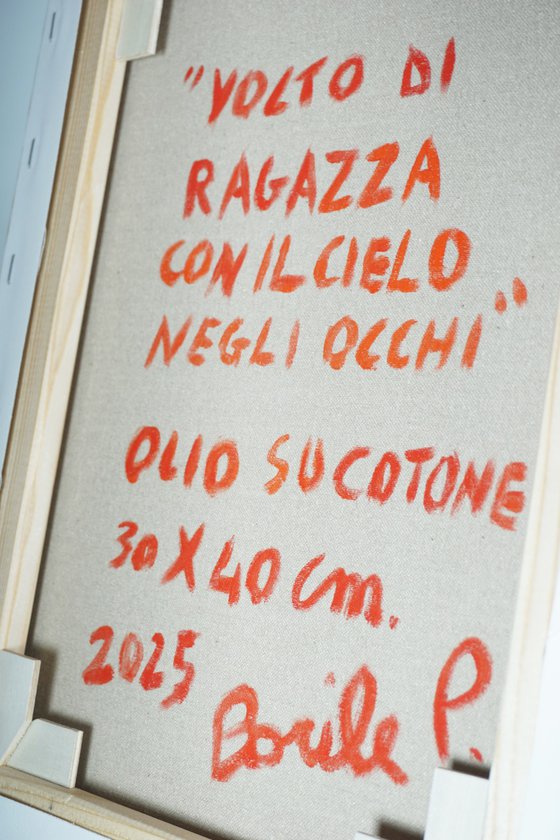 Young woman with the sky in her eyes