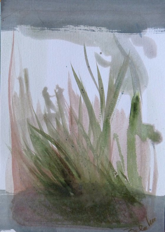 Behind the leaves of grass