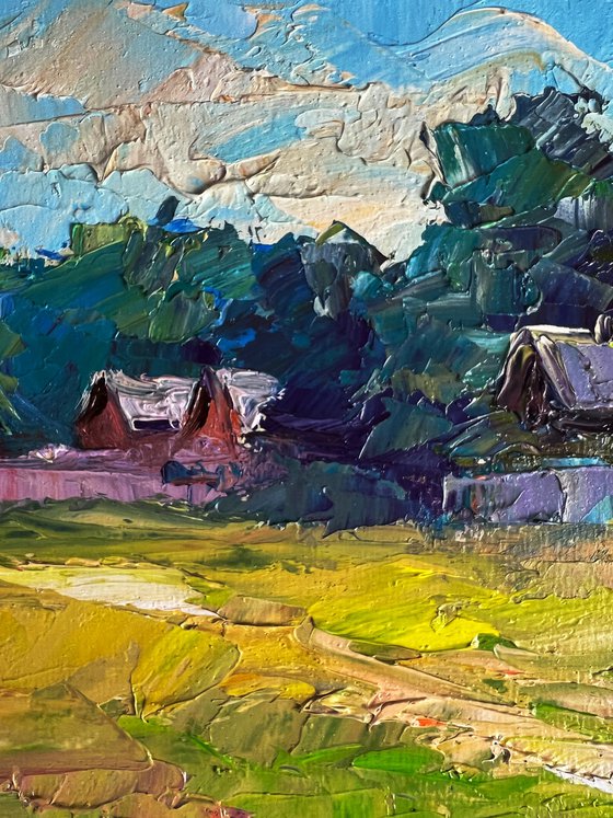 A Red Cow near the Houses
