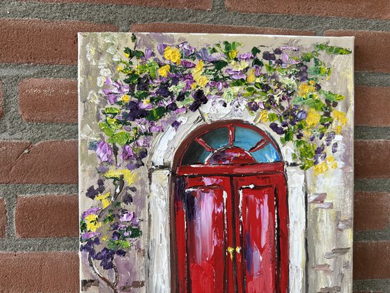 Red door with flowers