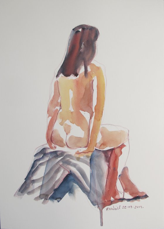 Seated female nude back view