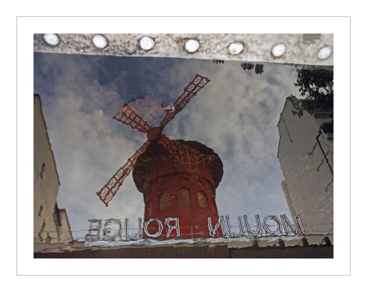 Moulin Rouge (reflection in a puddle) by Beata Podwysocka