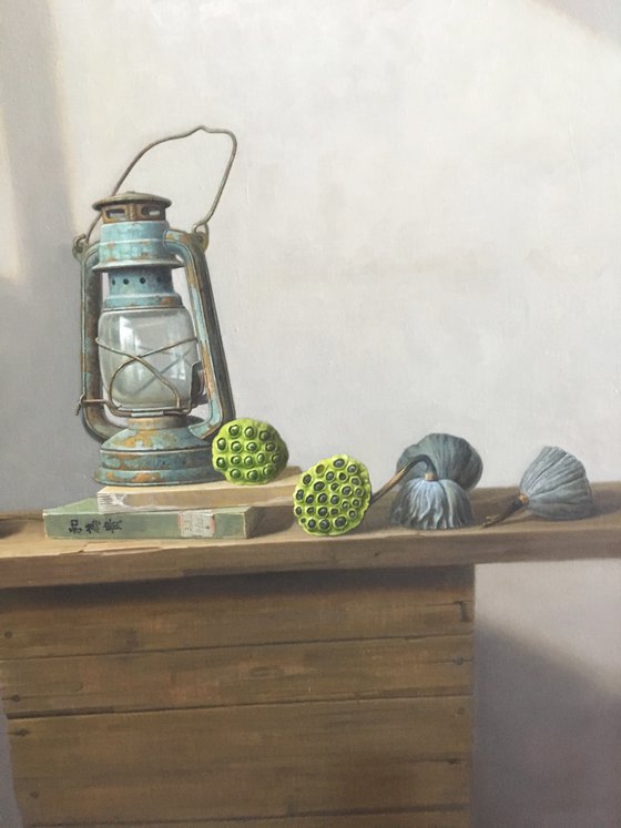 Still life zen art:kerosene lamp with lotus seedpod