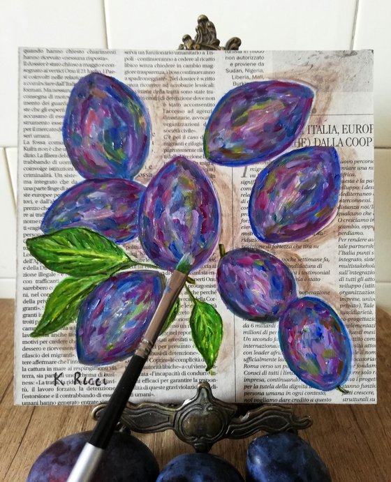 Plums on Newspaper