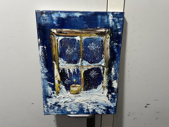Winter window and candle