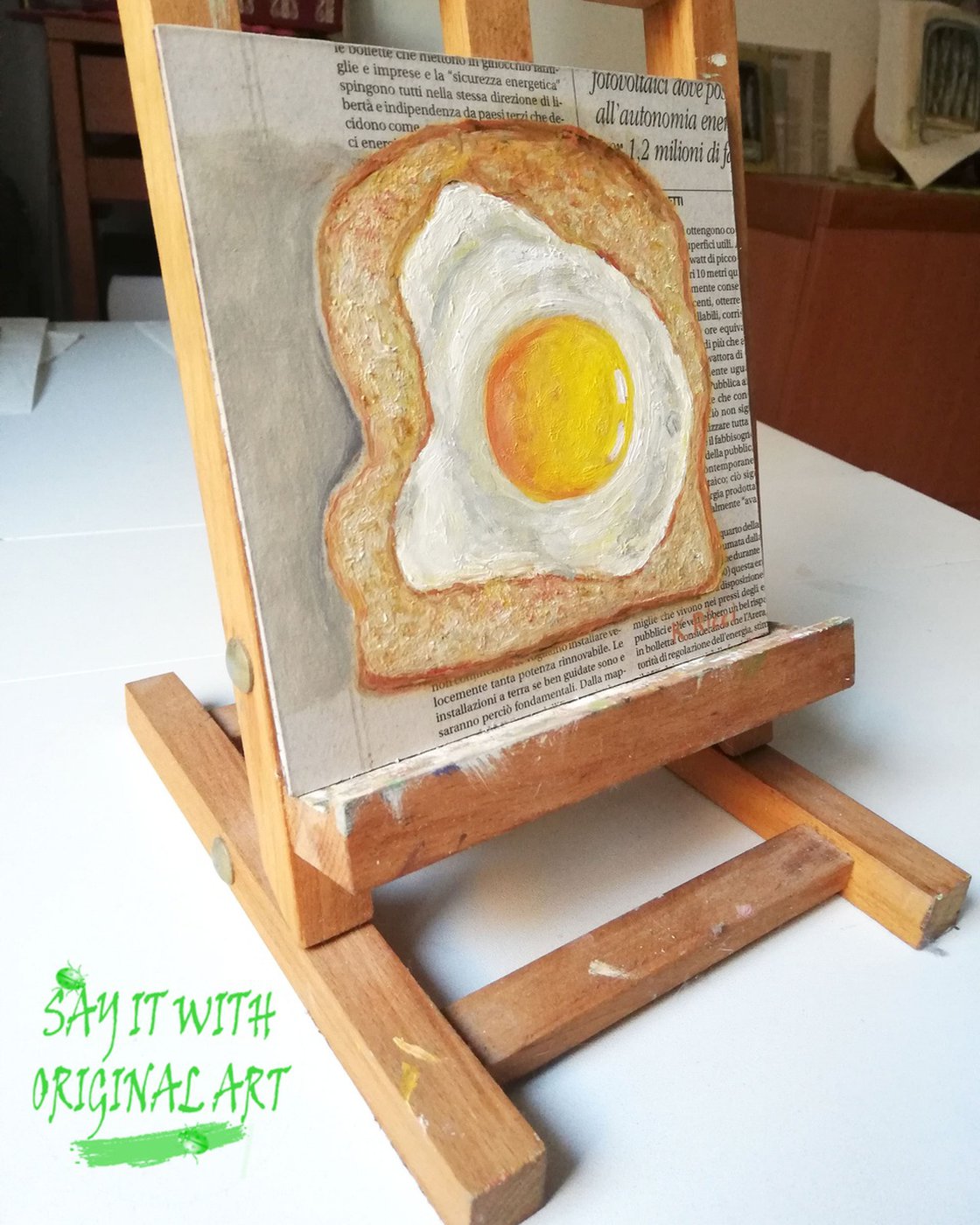 Fried egg with spice and bread slices in white ceramic frying pan on wooden  board Stock Photo by sonyakamoz