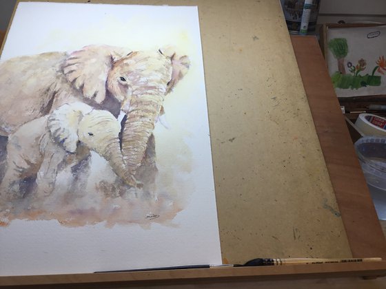 Elephants walking in the dust