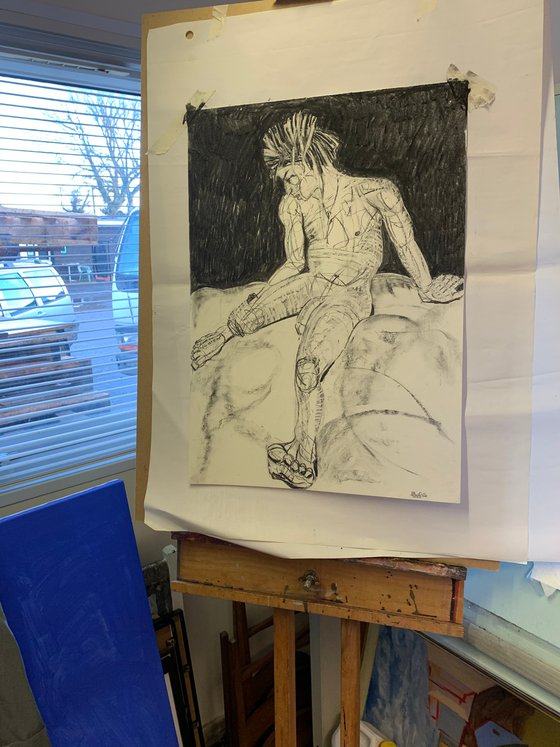 “Young Male Nude Seated with Dreadlocks”
