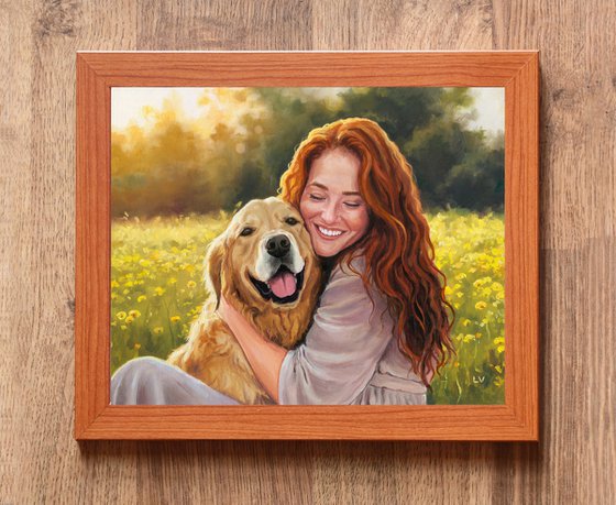 Smiling red-haired woman hugging a dog