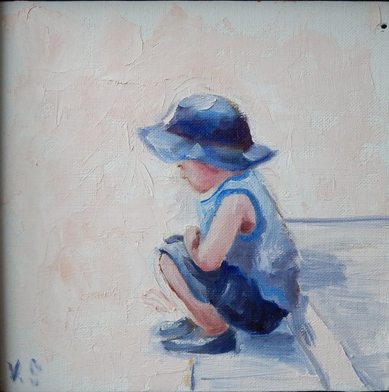 Boy in a blue hat.