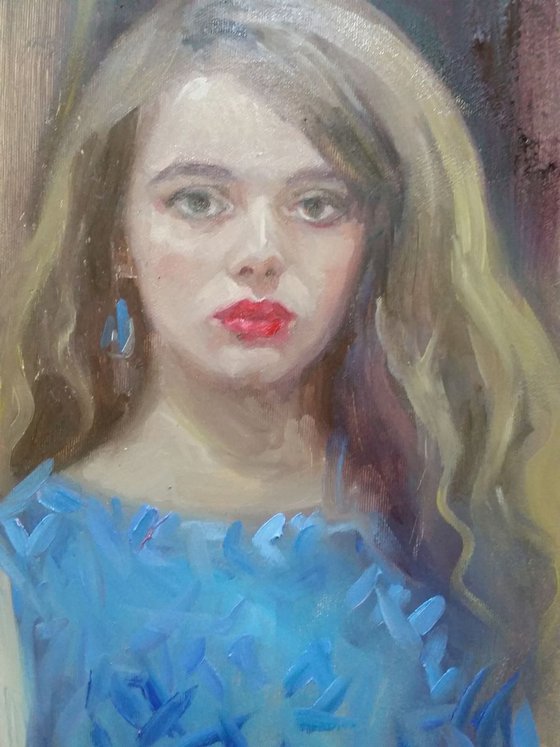 portrait of a young lady in blue dress