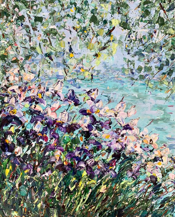 Blooming irises by the pond