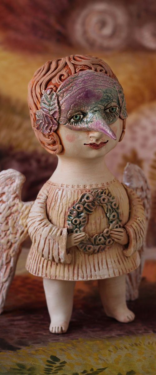 Angel holding a mask. Ceramic OOAK sculpture. by Elya Yalonetski