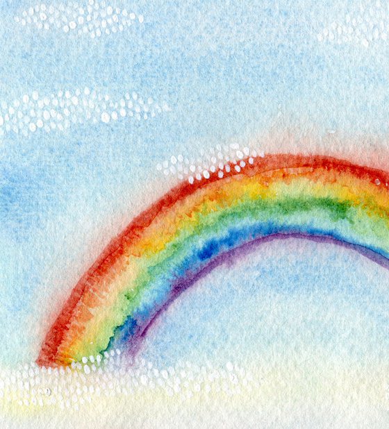 Watercolor rainbow in blue sky