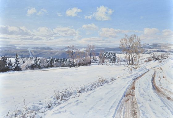 Path in the snow-capped Velay mountains