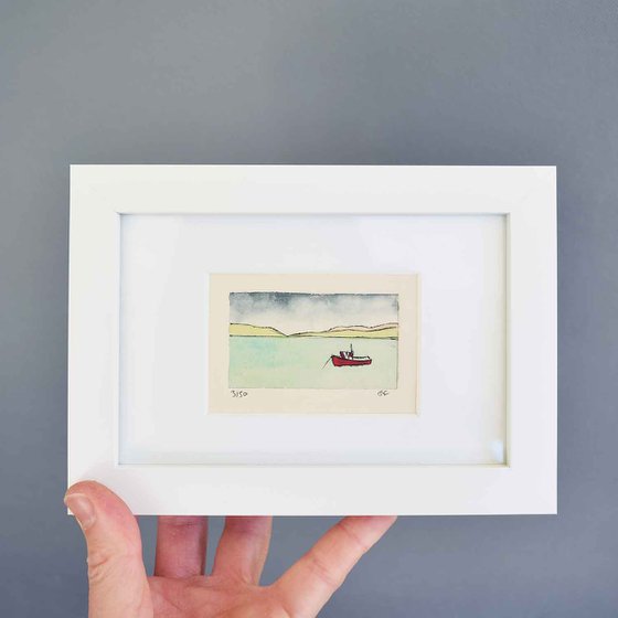 Small framed red fishing boat