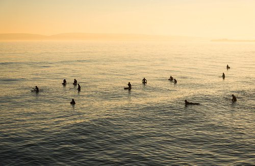 SUNSET SURFERS by Andrew Lever
