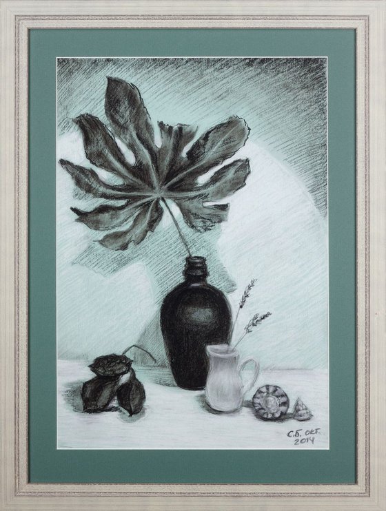 Black vase with maple leaf