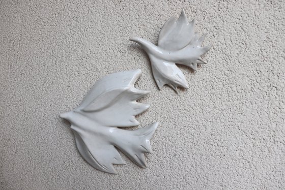 Two doves . Hanging on the wall sculpture.