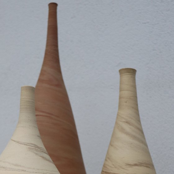 Three mixed clay vessels
