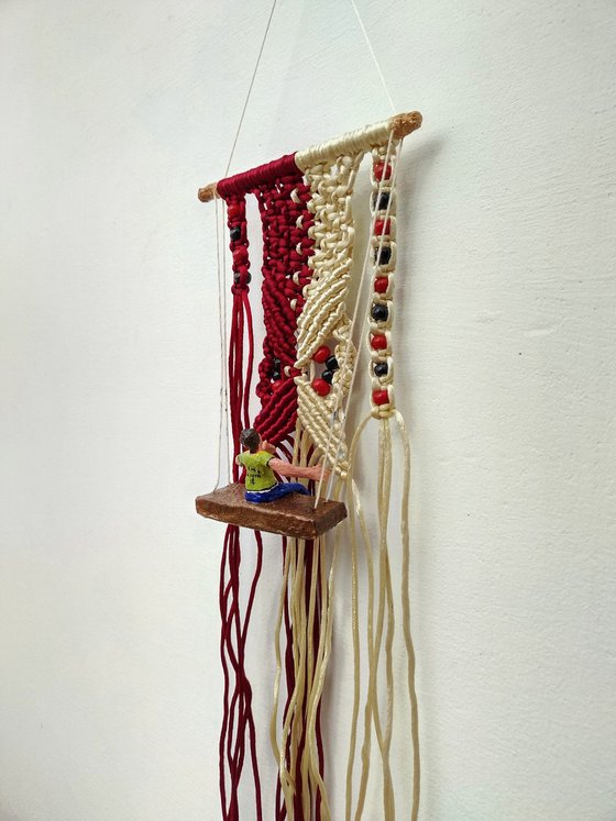 Boy and macrame wall hanging