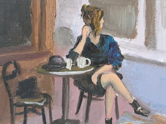 A woman in French cafe