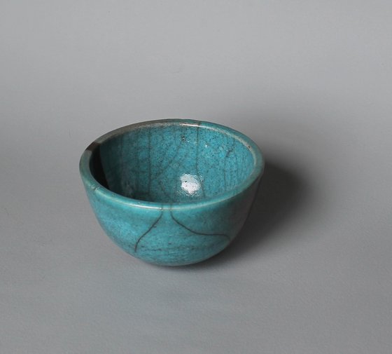 Raku Bowl with a smoked black stripe.